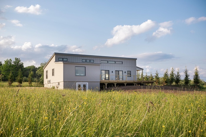 Back of house with a wooden deck