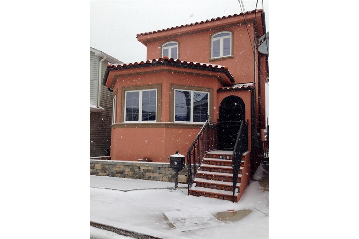Mediterranean / spanish home with a tiled roof and stucco siding