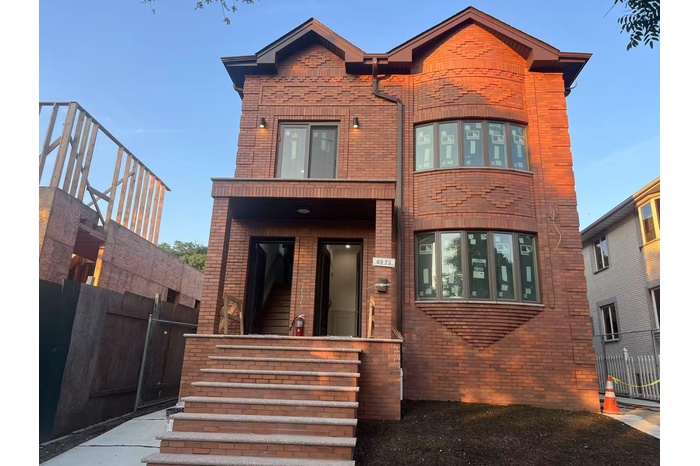 View of front of property featuring brick siding