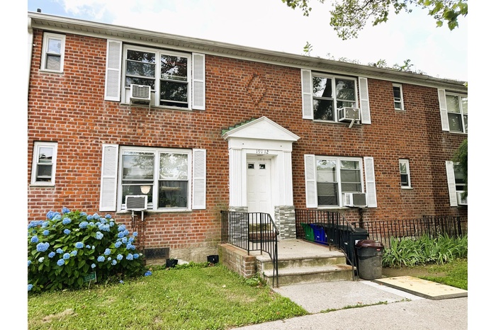 Colonial house with brick siding