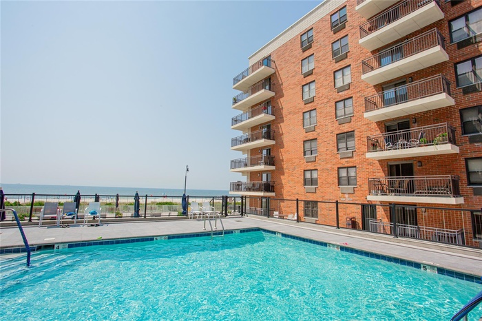 Community pool with a water view