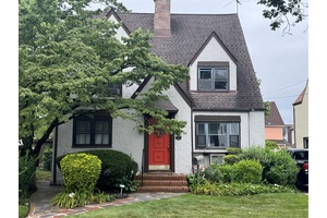 This beautiful Tudor Style property is register as a Historical Landmark, it set on a 5, 000 square foot tree line lot, located in beautiful Addisleigh Park.