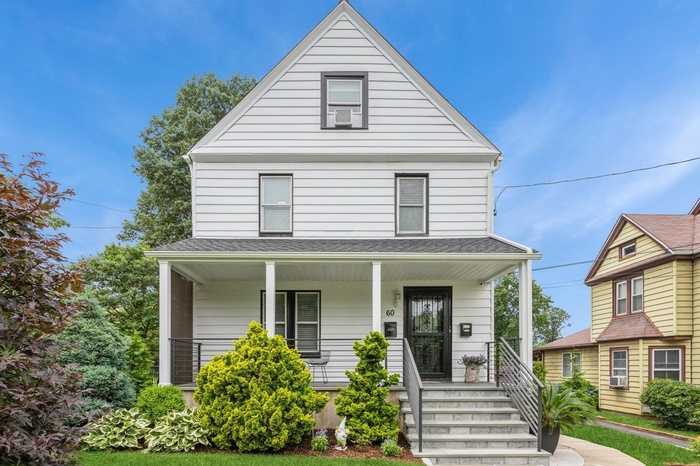 View of front of house with covered porch