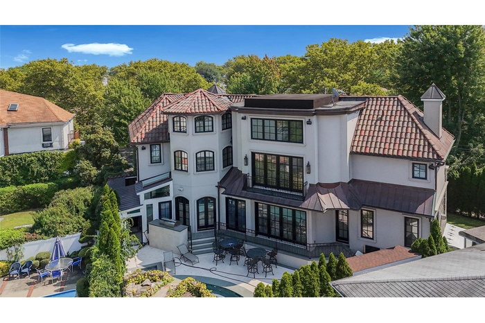 Mediterranean / spanish-style house featuring a patio, fence, a tiled roof, and stucco siding