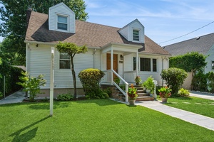 Beautifully updated wide Cape with a full dormer, ideally located near LIRR, major highways, top rated Roslyn schools, and local restaurants perfect for NYC commuters.