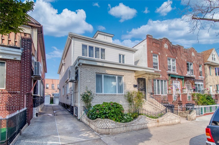 View of front of house featuring brick siding