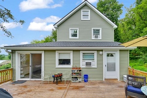 Welcome to 9 Fava Lane, a rare and versatile offering in the heart of the Pine Island farming community.