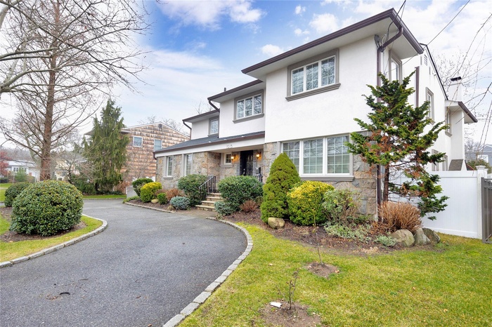 View of front of property with stone siding and stucco siding