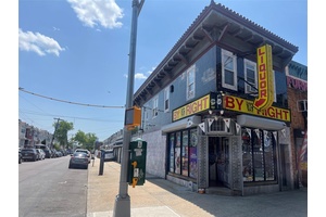 Mixed use commercial property featuring two separate apartments on the second floor one 2 bedroom unit and one 1 bedroom unit.