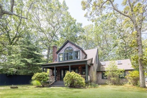 Located just 450 yards from a stunning sandy bay beach, this handsome Cape style home offers the perfect blend of coastal charm and year round comfort.