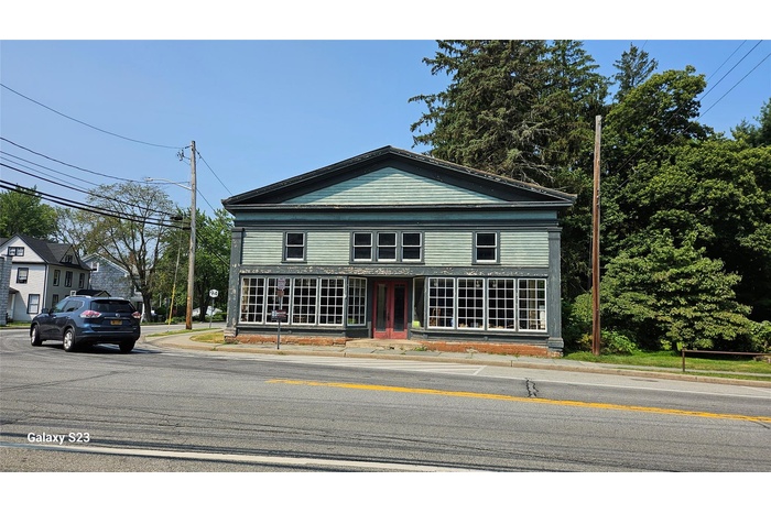 Corner 1.3 Acre lot with Greek revival building that housed antique store.
