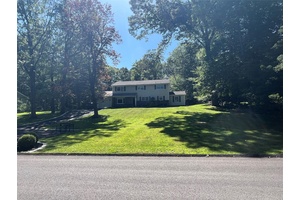 Walk into this immaculate, beautiful home sitting on a huge park like property.