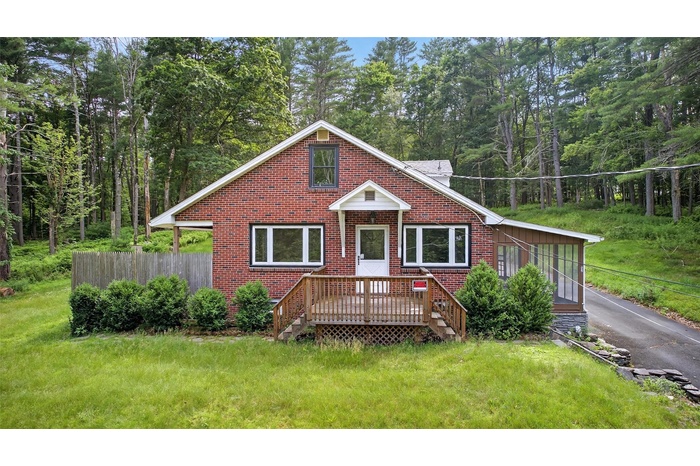 View of front of property featuring brick siding