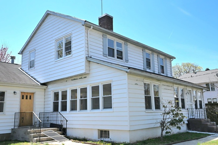 View of front of home with a chimney
