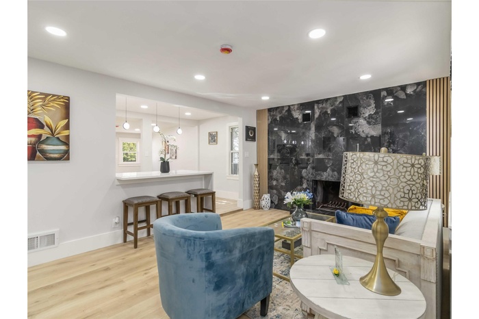 Living area featuring recessed lighting and wood finished floors