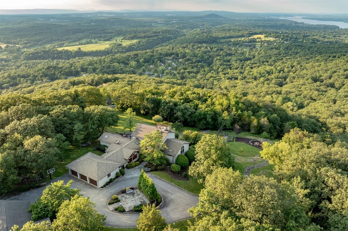 Aerial overview of property's location with a forest
