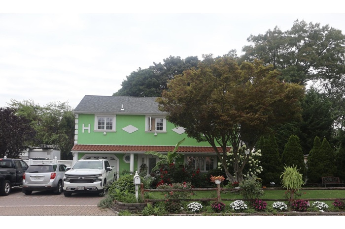 View of front of property featuring decorative driveway