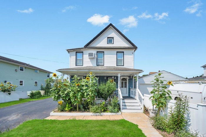 View of front of property with a porch