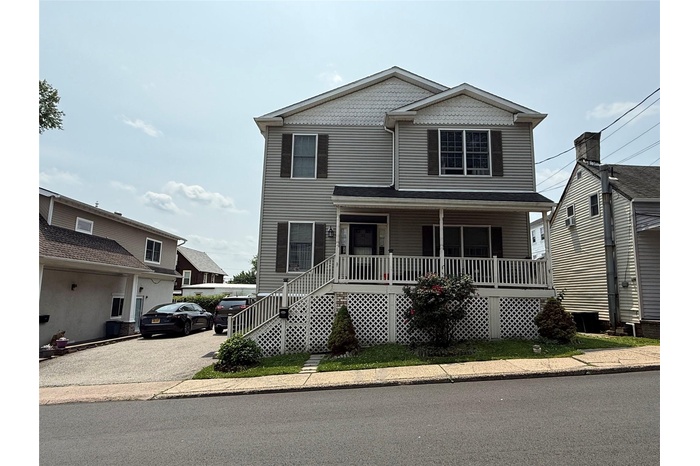 View of front of house. Unit entrance is in the back