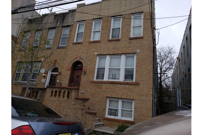 View of front facade featuring brick siding
