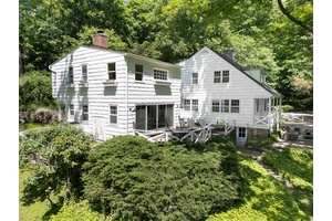 Tucked away in a 3 acre private storybook setting, this reimagined farmhouse blends timeless charm with modern comfort.