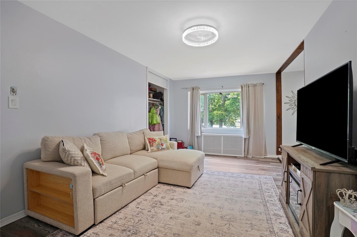 Living room featuring light wood-style flooring