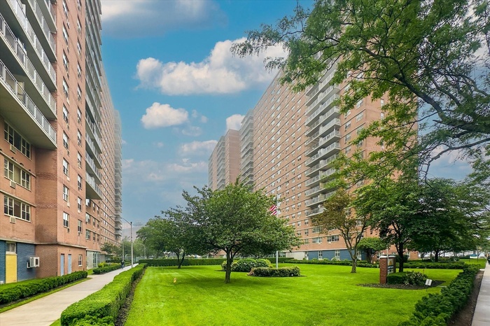 View of property's community featuring a yard