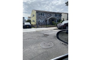 2 family semi attached 3 3 bedrooms, 2 kitchens, 2 baths on each floor, living room and dining area for each floor.