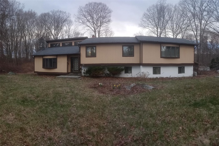 View of front of property with a front lawn