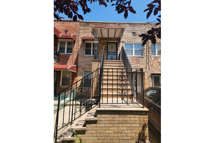 Doorway to property featuring stone siding