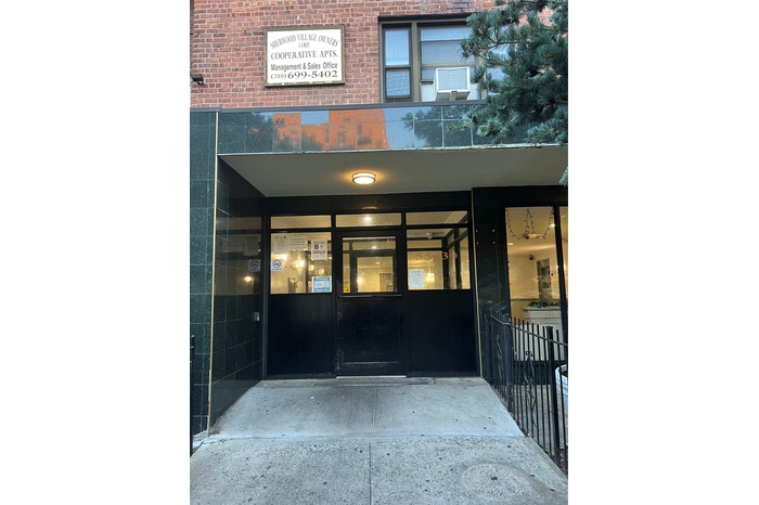 Property entrance with brick siding