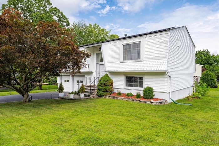 View of front of house with a front yard