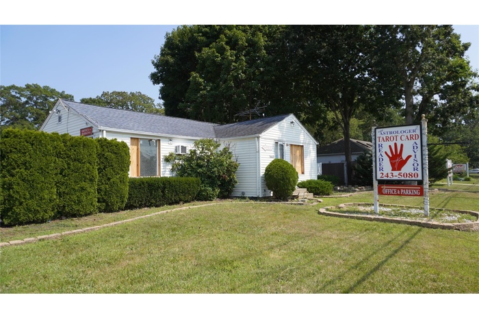 View of front of property with a front yard