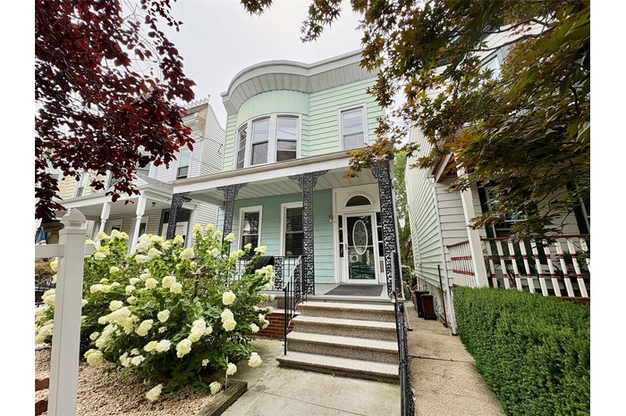 Property entrance featuring covered porch