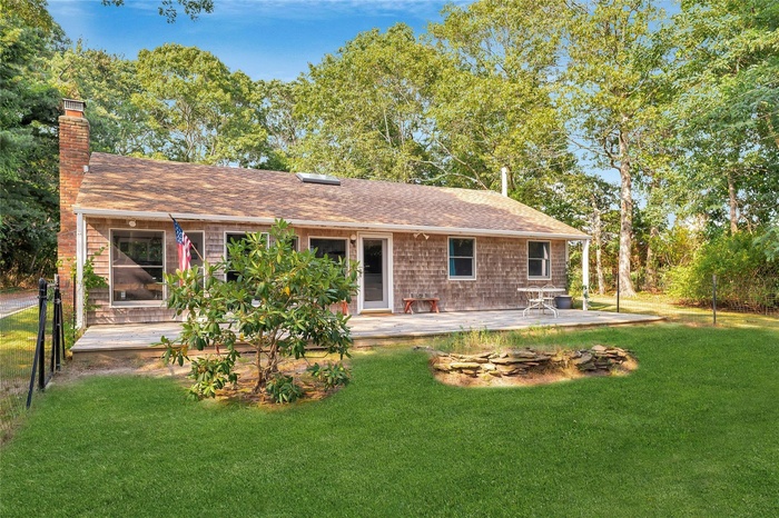 Welcome to 2 Fairview St Westhampton! Enjoy the large, front deck.