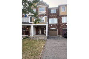 Well Maintained Freehold Townhouse with Two Parking Spaces in the Driveway and One in the Garage.