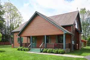 Tucked onto a serene property just shy of 1acre, this handsome log style Post amp ; Beam home is in harmony with its natural surroundings.