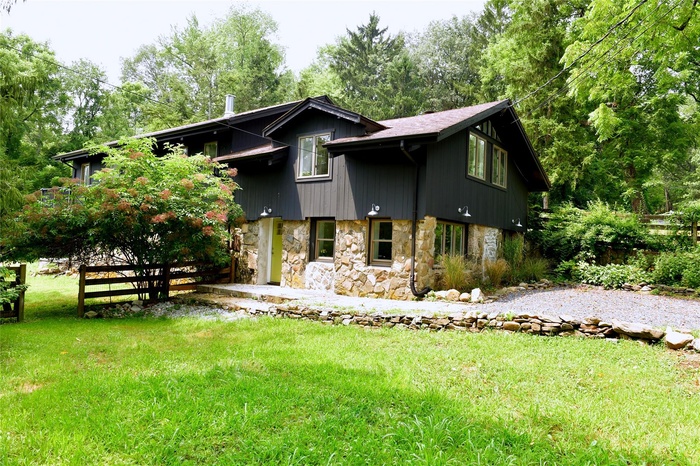 View of front of property featuring stone siding