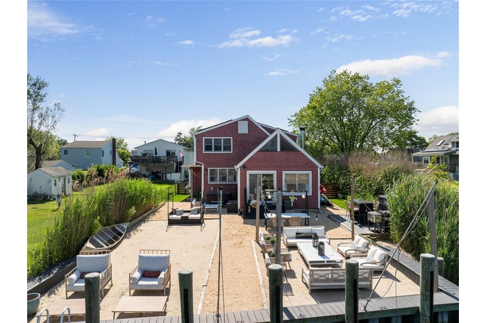 Back of property with an outdoor hangout area and a patio