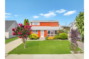 Welcome to this beautifully maintained Expanded Cape nestled on a quiet street in the heart of Hicksville.