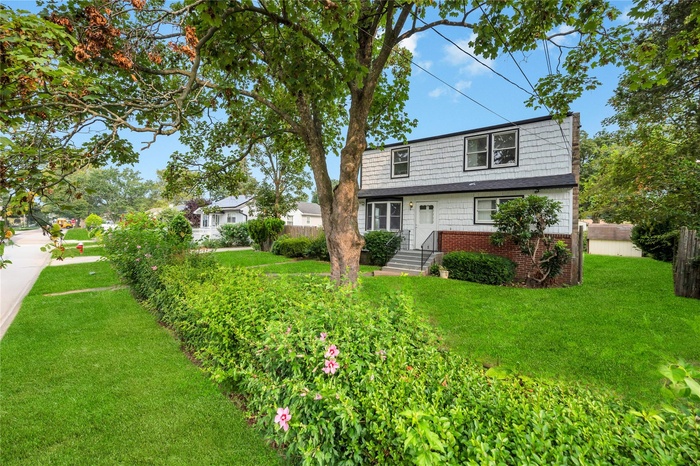 View of front of house with brick siding