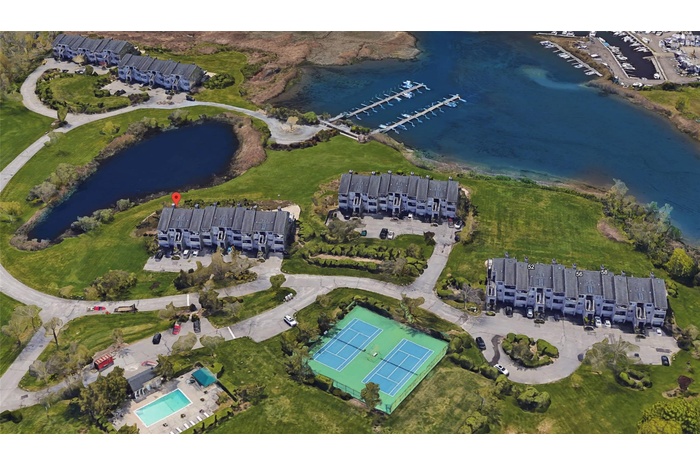 View of property location with a nearby body of water