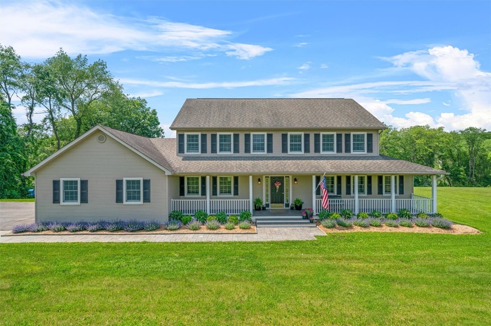 Colonial inspired home with covered porch.