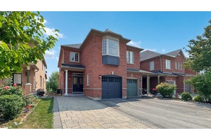 Newly renovated townhouse end unit offering spacious living, including a finished walk out basement, backing onto a serene ravine and pond for enhanced privacy.