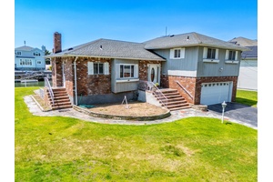 Welcome to your next great investment or dream home opportunity, perfectly positioned on the canals of Old Harbour Green, one of Massapequa's most coveted waterfront communities.