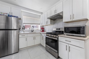 Beautiful detached 2 family brick house located at heart of Whitestone Beechhurst neighborhood with Throgs Neck Bridge View.