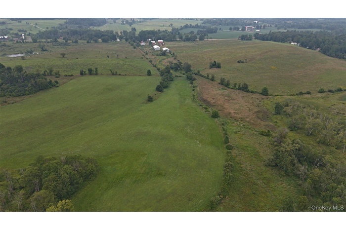 Aerial view of property and surrounding area with rural landscape