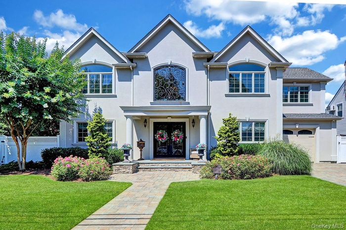 View of front of home with stucco siding