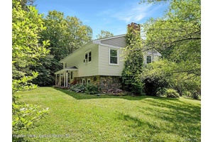 Private Split Level on 3 Acres Tucked away in a quiet, wooded setting, this 3 bedroom, 2.
