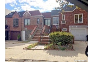This mint condition attached brick house is conveniently located in the heart of Maspeth, closed to all public transportation and LIE expressway.